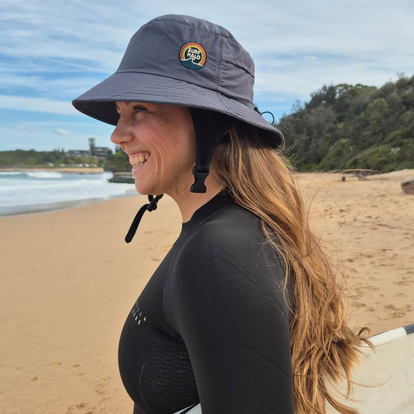 woman wearing a surf hat helmet with inner protective shell and ear muffs